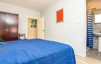 Krevet ili kreveti u jedinici u objektu 5 Bedroom Lovely Apartment In Raslina