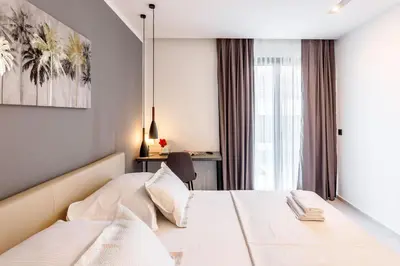 Krevet ili kreveti u jedinici u objektu Villa Skyline- near beach and city center with heated pool