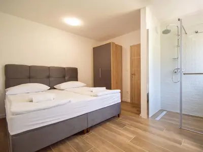 Krevet ili kreveti u jedinici u objektu Holiday Home Joy on Countryside by Interhome