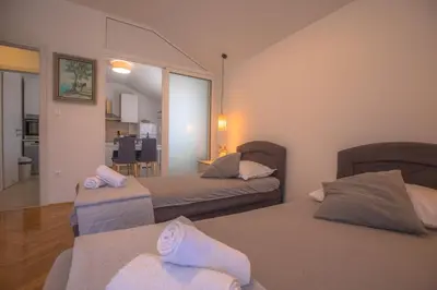 Krevet ili kreveti u jedinici u objektu APARTMANI SLAMIĆ