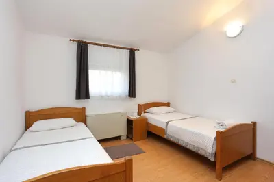 Krevet ili kreveti u jedinici u objektu Apartments by the sea Rogoznica - 4162
