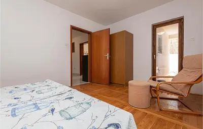 Krevet ili kreveti u jedinici u objektu 3 Bedroom Cozy Apartment In Brodarica