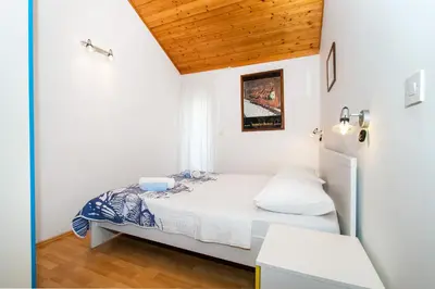 Krevet ili kreveti u jedinici u objektu Apartments Family corner