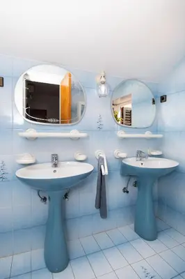 Kupaonica u objektu Apartments and Room Agiss with pool