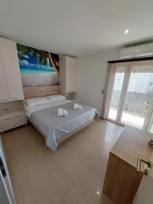 Krevet ili kreveti u jedinici u objektu Apartmani Tropical