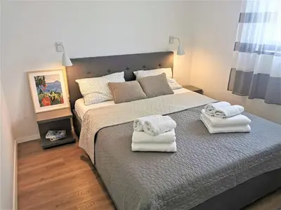 Krevet ili kreveti u jedinici u objektu Beach front apartment with beautiful sunsets