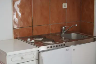 Kuhinja ili čajna kuhinja u objektu Apartments villa Sunset