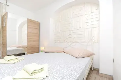 Krevet ili kreveti u jedinici u objektu Apartments and Room Take it easy