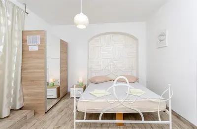 Krevet ili kreveti u jedinici u objektu Apartments and Room Take it easy
