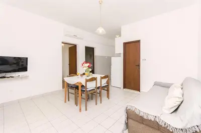 TV i/ili zabavni centar u objektu Apartments and Room Lotus