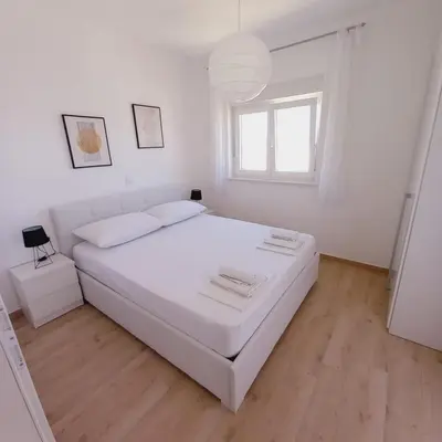 Krevet ili kreveti u jedinici u objektu Apartments M & L Murter