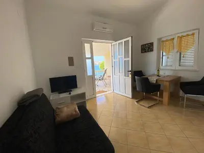 TV i/ili zabavni centar u objektu Apartmani-joe