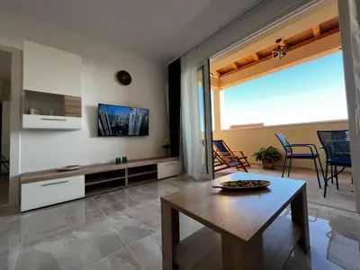 TV i/ili zabavni centar u objektu Pekasovi Seaview Apartament on a beautiful island Krapanj