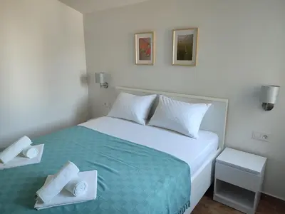 Krevet ili kreveti u jedinici u objektu Apartments V&V-Murter Hideaway