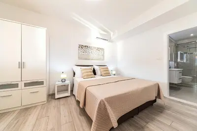 Krevet ili kreveti u jedinici u objektu Luxury 2 etage apartment with private heated pool