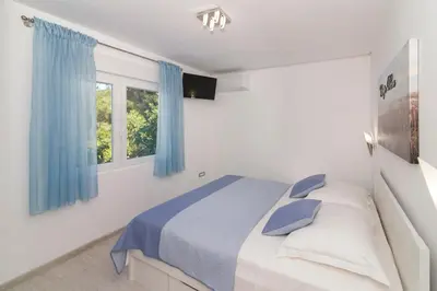 Krevet ili kreveti u jedinici u objektu Rozali Tisno Apartments