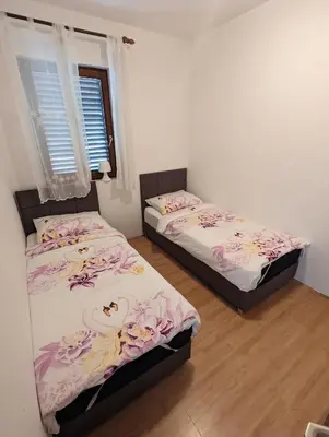 Krevet ili kreveti u jedinici u objektu Apartments Magnolija 50m from beach