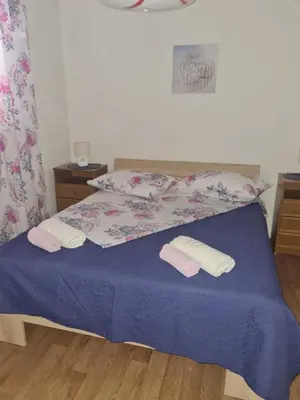 Krevet ili kreveti u jedinici u objektu Apartments Triton