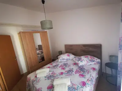 Krevet ili kreveti u jedinici u objektu Apartments Triton