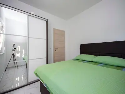 Krevet ili kreveti u jedinici u objektu Apartments Happy Holiday