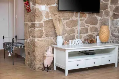 TV i/ili zabavni centar u objektu Luxury stone house Amfora