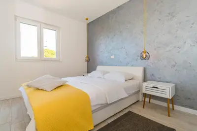 Krevet ili kreveti u jedinici u objektu Apartments Delfin