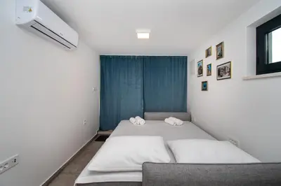 Krevet ili kreveti u jedinici u objektu Apartmani Monika