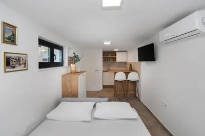 Krevet ili kreveti u jedinici u objektu Apartmani Monika